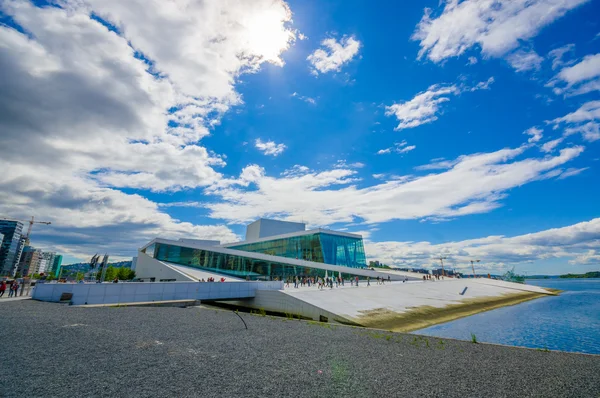 OSLO, NORWAY - 8 JULY, 2015: Beautiful opera house located on waterfront seen from a low angle, sunny and blue sky — Stock Photo, Image