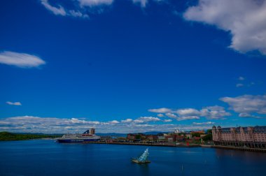OSLO, NORWAY - 8 JULY, 2015: Oslofjord as seen from the roof of opera building, art installation and some ships visible, beautiful blue sky