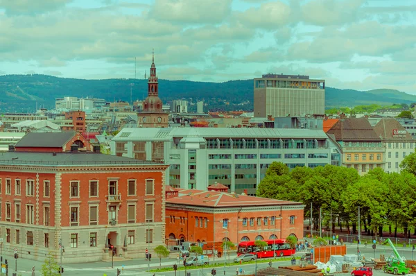 OSLO, NORWAY - 8 JULY, 2015: Great view from roof of opera building showing city rooftops and green hillsides in distance — Stock fotografie