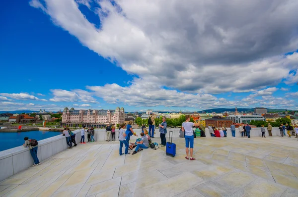 OSLO, NORWAY - 8 JULY, 2015: Walking on the spectacular opera house building located waterfront eastside of city with beautiful architecture and views — стокове фото