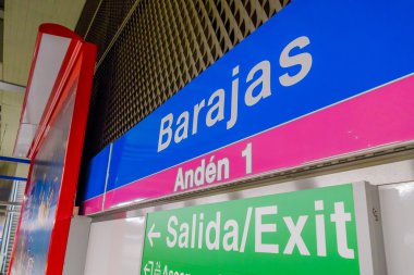MADRID, SPAIN - 8 AUGUST, 2015: Signs of location and emergency exit at the train station Barajas Airport