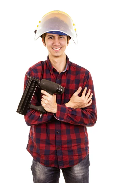 Hombre con una pistola de clavos —  Fotos de Stock