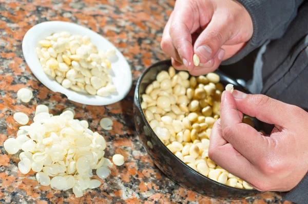 Closeup peeling, before and after bowls with lupini beans superfood, part of legum family, preparing fanesca concept — Stock Image Closeup peeling, before and after bowls with lupini beans superfood, part of legum family, preparing fanesca concept Stock Picture