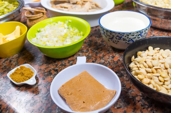 Bowls of different ingredients spread out on granite surface including green peas, onions, abbas, corn, fish, motte, turmeric spice, lupini and red beans, preparing fanesca concept — Stock Image Bowls of different ingredients spread out on granite surface including green peas, onions, abbas, corn, fish, motte, turmeric spice, lupini and red beans, preparing fanesca concept Stock Picture