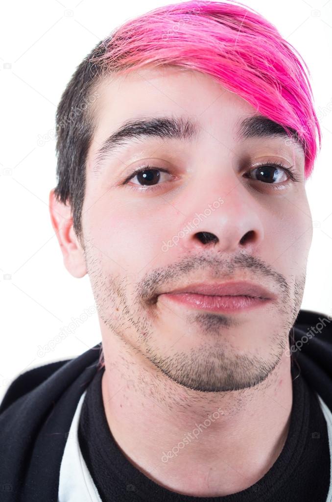 Headshot hispanic young adult with pink hair and black hoodie sweater posing for camera making facial expressions