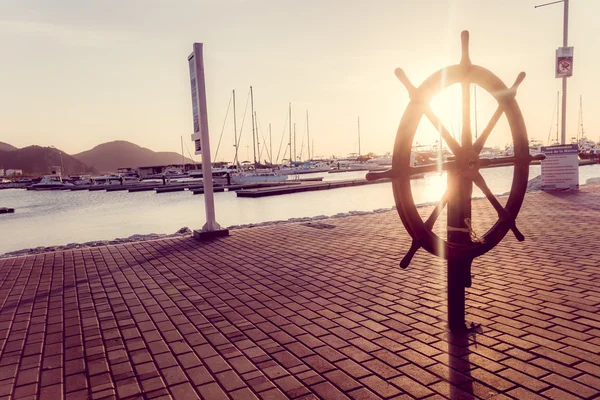 Vintage helm boat steering wheel in esplanade, Santa Marta, Colombia