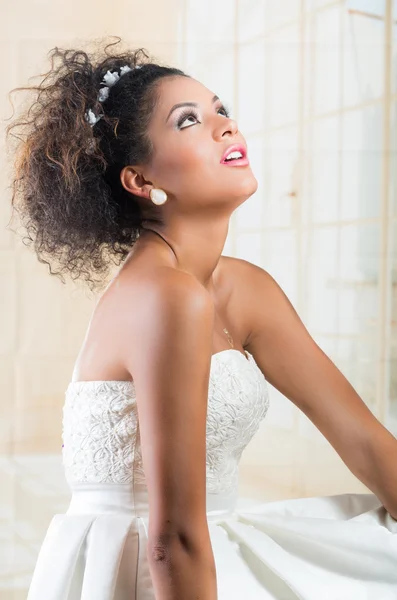 Gorgeous curly brunette bride looking up — Stock Photo, Image