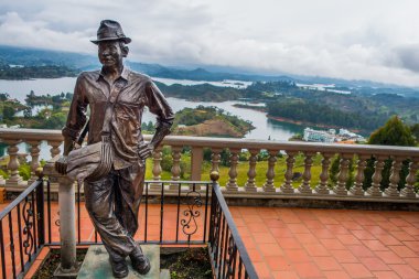 Statue of Luis Eduardo Villegas, Guatape, Colombia clipart