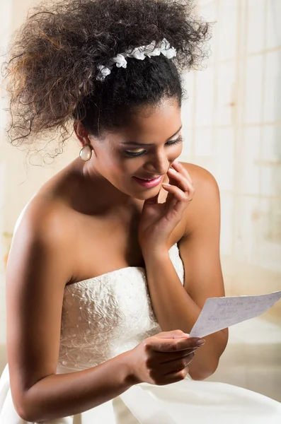 Emotional beautiful bride reading a love letter — Stock Photo, Image