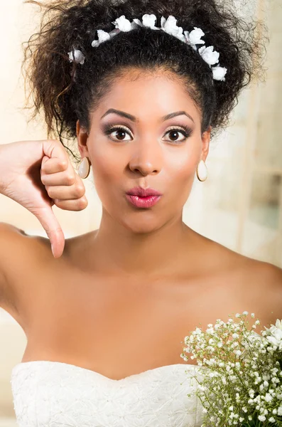 Portrait of beautiful exotic emotional bride holding thumb down — Stok Foto