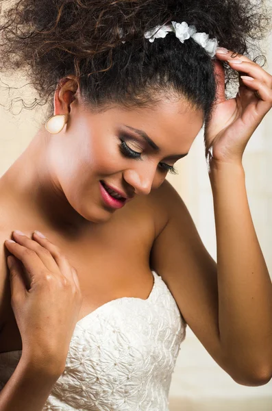 Radiant hispanic bride wearing a white dress. — Stock Photo, Image