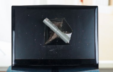 Remote control stuck inside broken computer screen