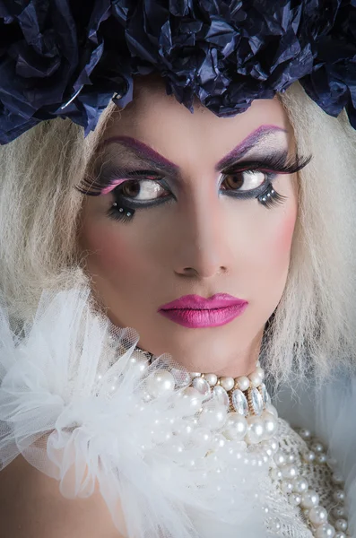 Drag Queen with spectacular makeup, glamorous trashy look, posing serious facial expression — стоковое фото