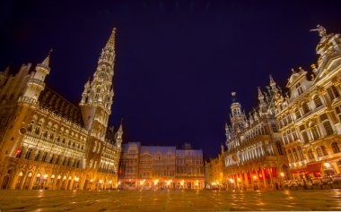 BRUSSELS, BELGIUM - 11 AUGUST, 2015: Grand Place with its fantastic lit up facades and towers during night time
