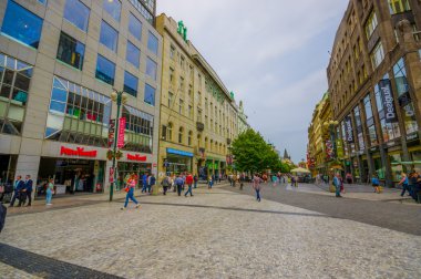 Prague, Czech Republic - 13 August, 2015: Charming city street with no traffic, bridgestone surface and shops on both sides
