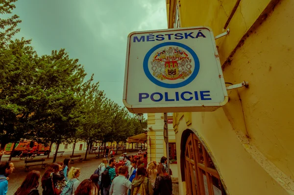 Prague, Czech Republic - 13 August, 2015: Police sign hanging from building indicating the presence of law enforcement — Stock Photo, Image