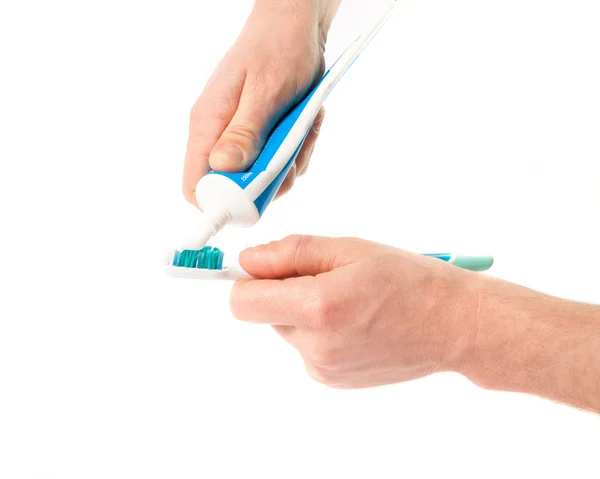 Toothbrush with toothpaste in the hand Stock Picture