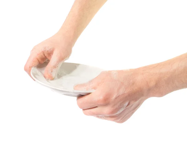 Les mains de l'homme lavant la vaisselle. Sur fond blanc — Photo