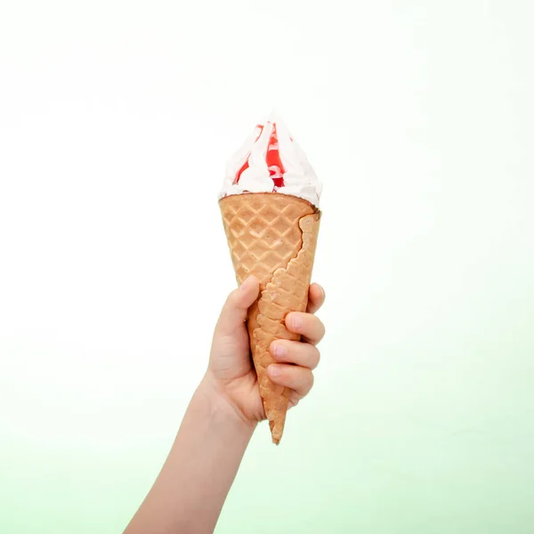 Ice cream in hand on a white background — Stock Photo, Image