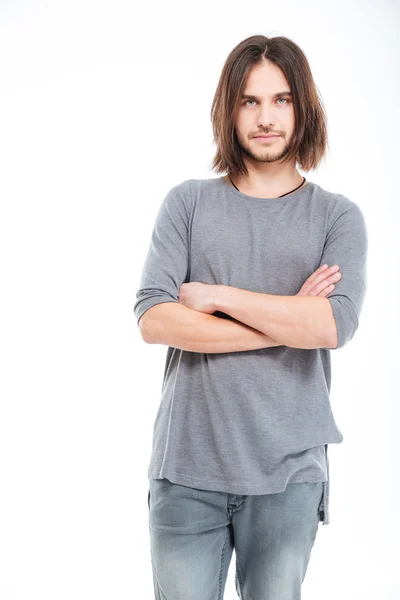 Attraktiver ernster junger Mann mit langen Haaren — Stockfoto