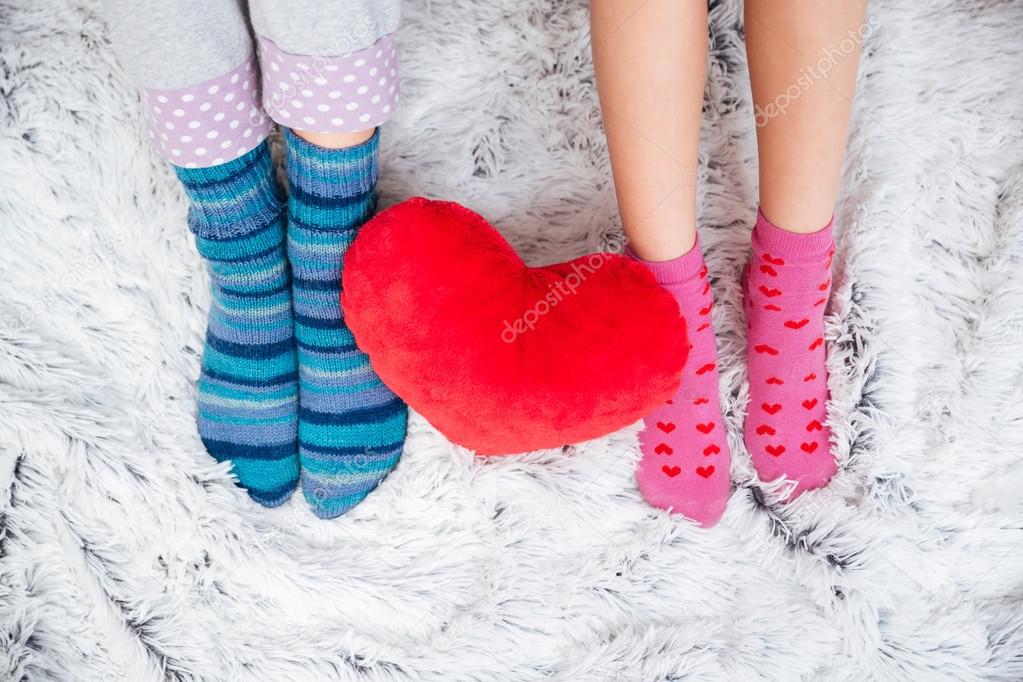 Beautiful legs of two young women in colorful socks 