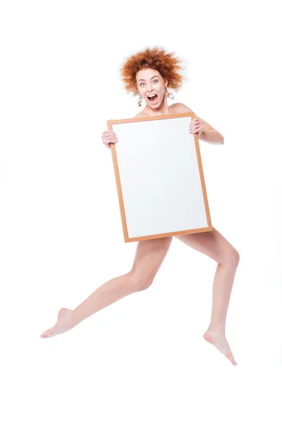 Redhead naked woman holding blank board — Stock Photo, Image
