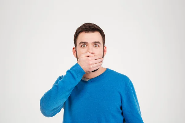 Man covering mouth with palm — Stock Photo, Image