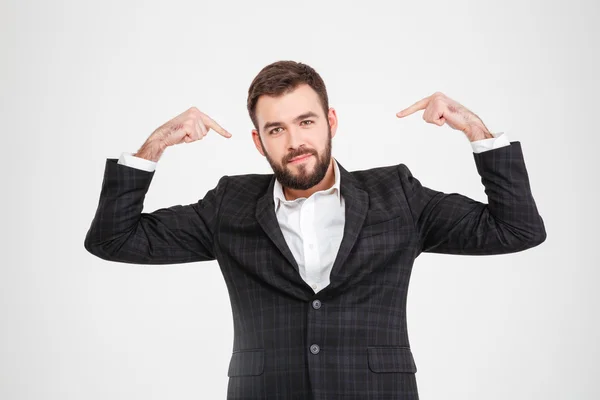 Proud businessman pointing fingers at herself — Stock Photo, Image