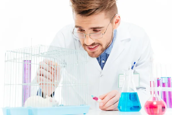 Scientist doing experiments with rat