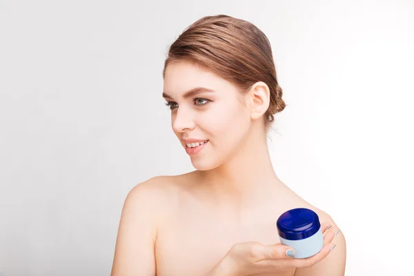 Woman holding moisturizing facial cream — Stock Photo, Image