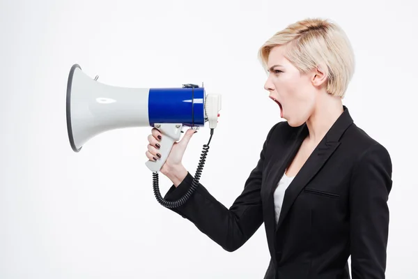 Businesswoman screaming into megaphone — Stock Photo, Image