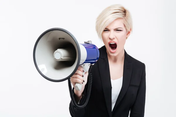 Ділова жінка кричить на гучномовця — стокове фото