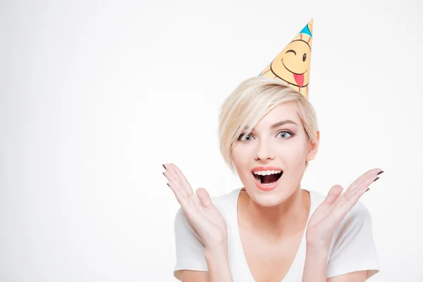 Cheerful woman in birthday hat looking at camera — Stock Photo, Image