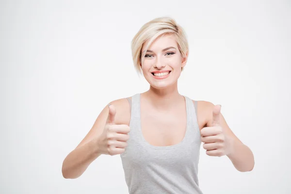 Sorrindo mulher mostrando polegar para cima — Fotografia de Stock