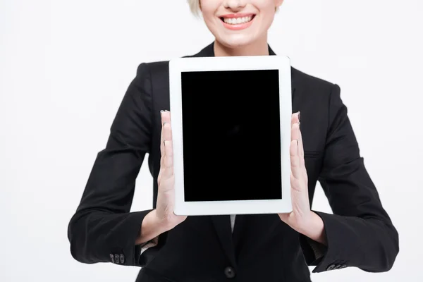 Happy businesswoman showing blank tablet computer screen Stock Photo