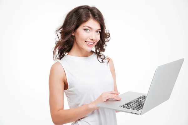 Smiling woman using laptop computer Royalty Free Stock Images