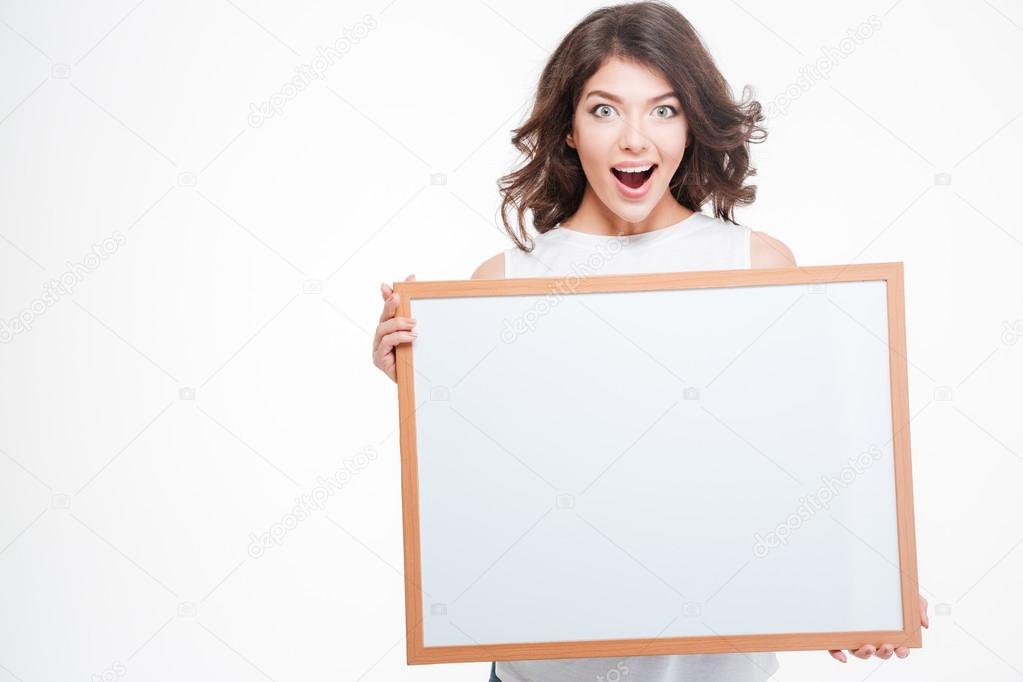 Cheerful woman holding blank board