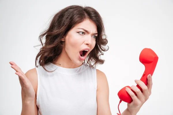 Zły kobieta krzyczy na telefon tube — Zdjęcie stockowe