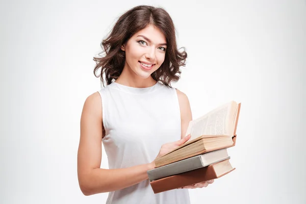 Donna sorridente che tiene libri di carta — Foto Stock