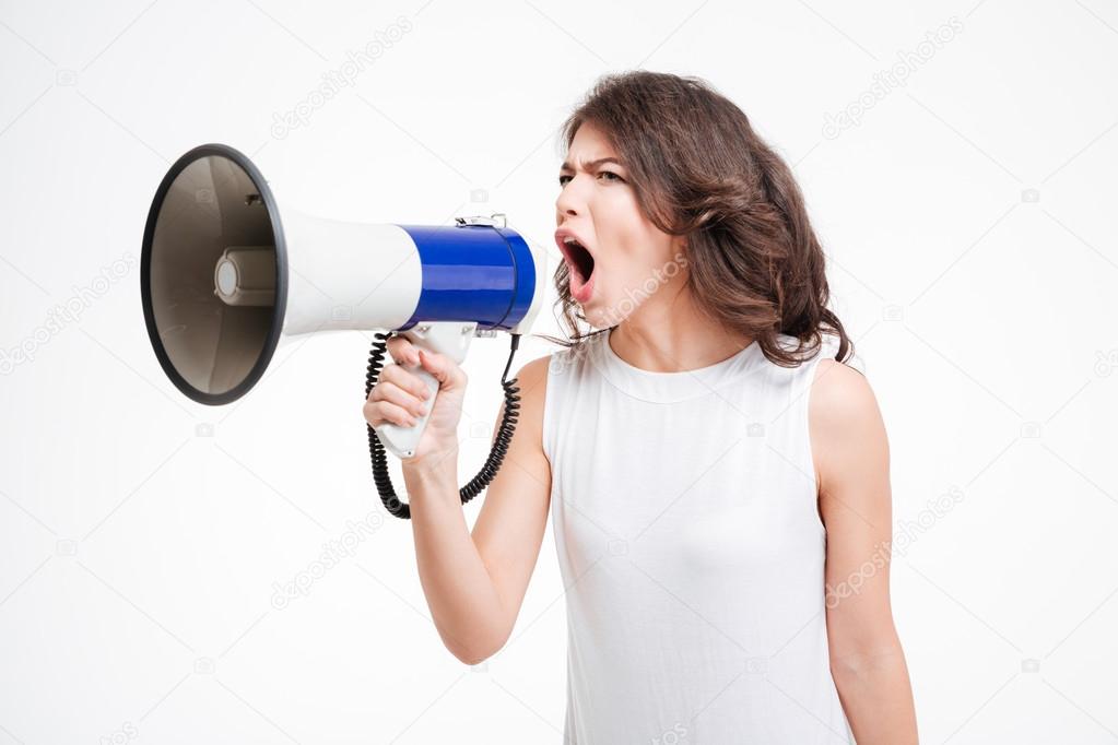 Young woman shouting into loudspeaker