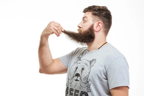 Megdöbbent azon, hogy szakállas ember tartja a szakállát — Stock Fotó