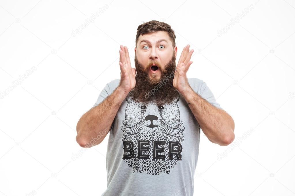 Surprised handsome bearded man with opened mouth
