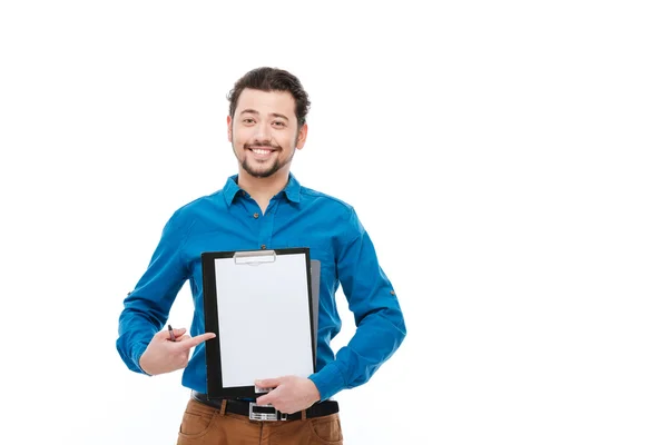 Smiling man showing blank clipboard — Stock Photo, Image