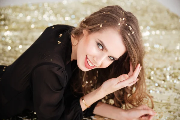 Cute lovely young woman  with sequins on her hair — Stock Photo, Image