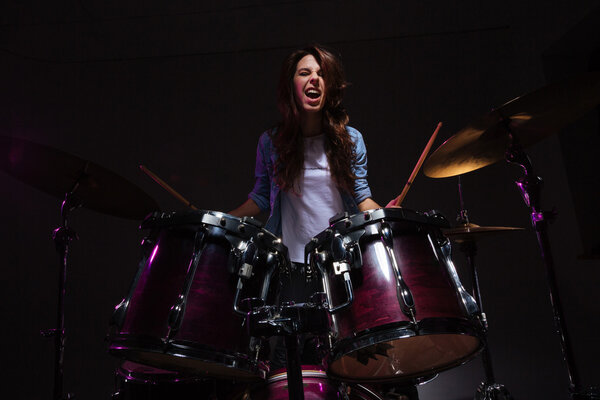 Woman playing the drums