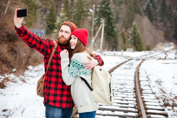 Couple making selfie photo on railway — Stock Photo, Image