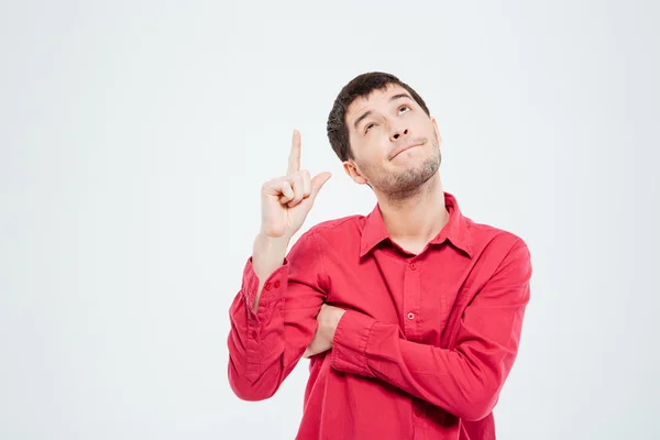 Casual man wijzende vinger omhoog — Stockfoto