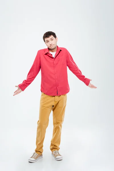 Young man shrugging shoulders — Stock Photo, Image