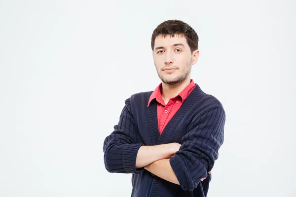 Bonito homem de pé com os braços dobrados — Fotografia de Stock