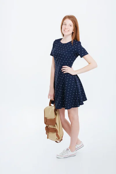 Happy woman in dress holding backpack — Stock Photo, Image